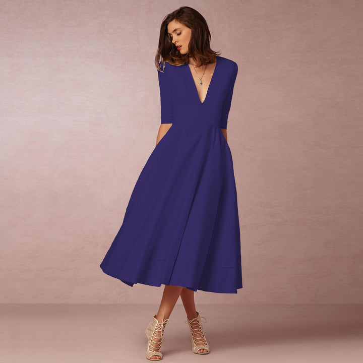 Evening Dress – Deep V Neckline & Flowing Skirt Design