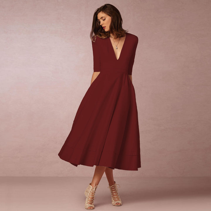 Evening Dress – Deep V Neckline & Flowing Skirt Design