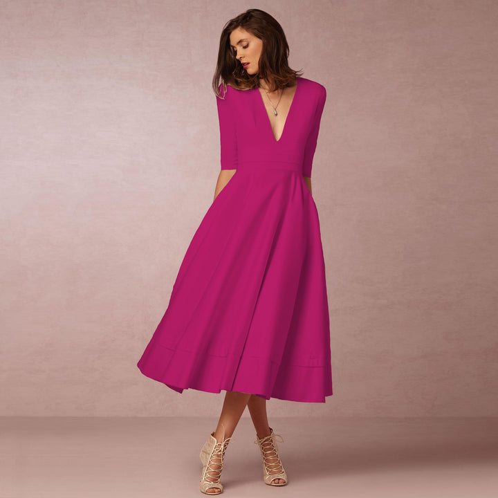 Evening Dress – Deep V Neckline & Flowing Skirt Design