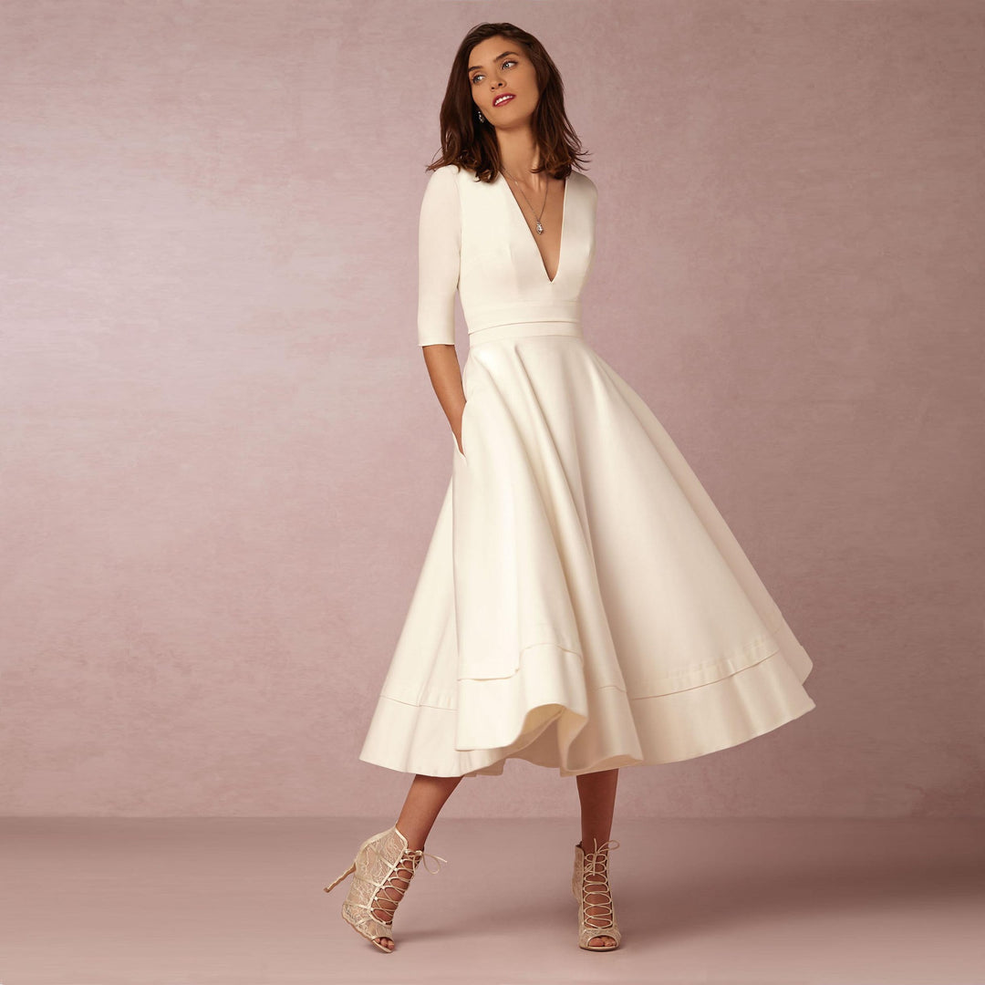 Evening Dress – Deep V Neckline & Flowing Skirt Design