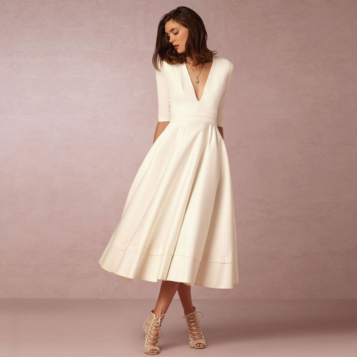 Evening Dress – Deep V Neckline & Flowing Skirt Design