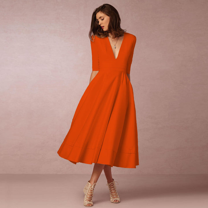 Evening Dress – Deep V Neckline & Flowing Skirt Design