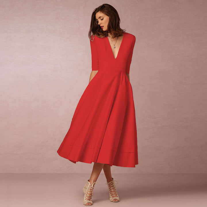Evening Dress – Deep V Neckline & Flowing Skirt Design